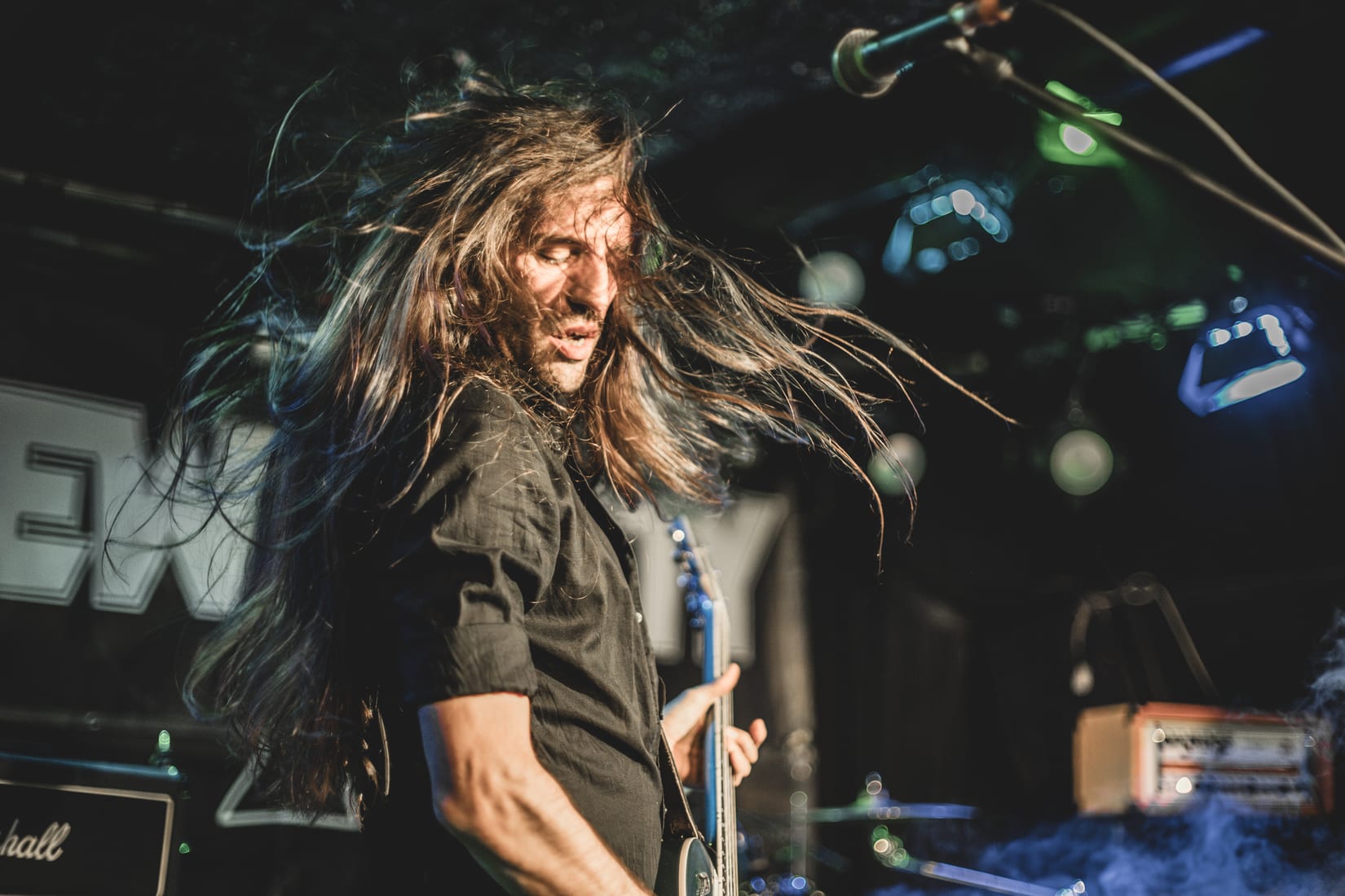 David Zenz mid-headbang on stage