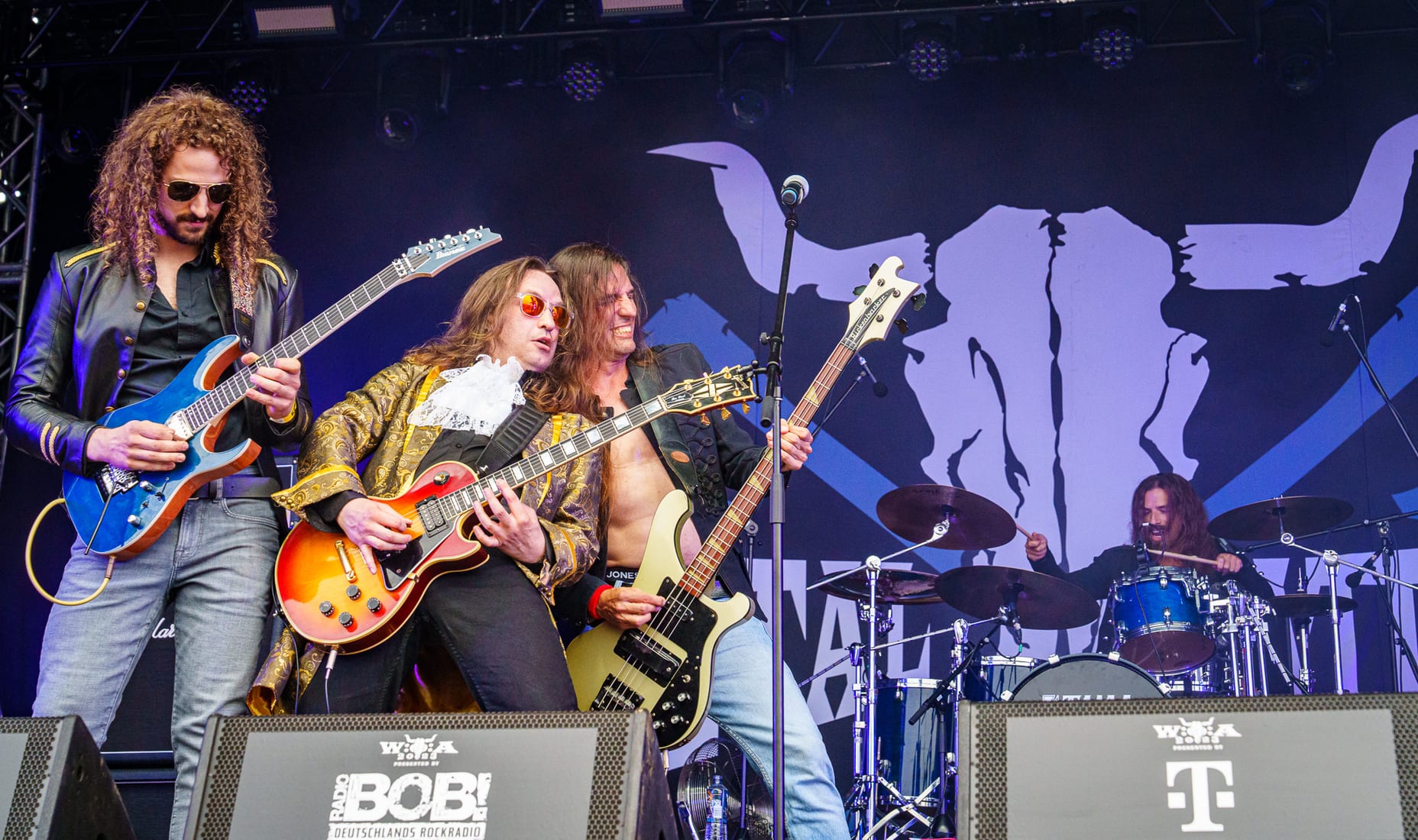Full band on stage at a festival